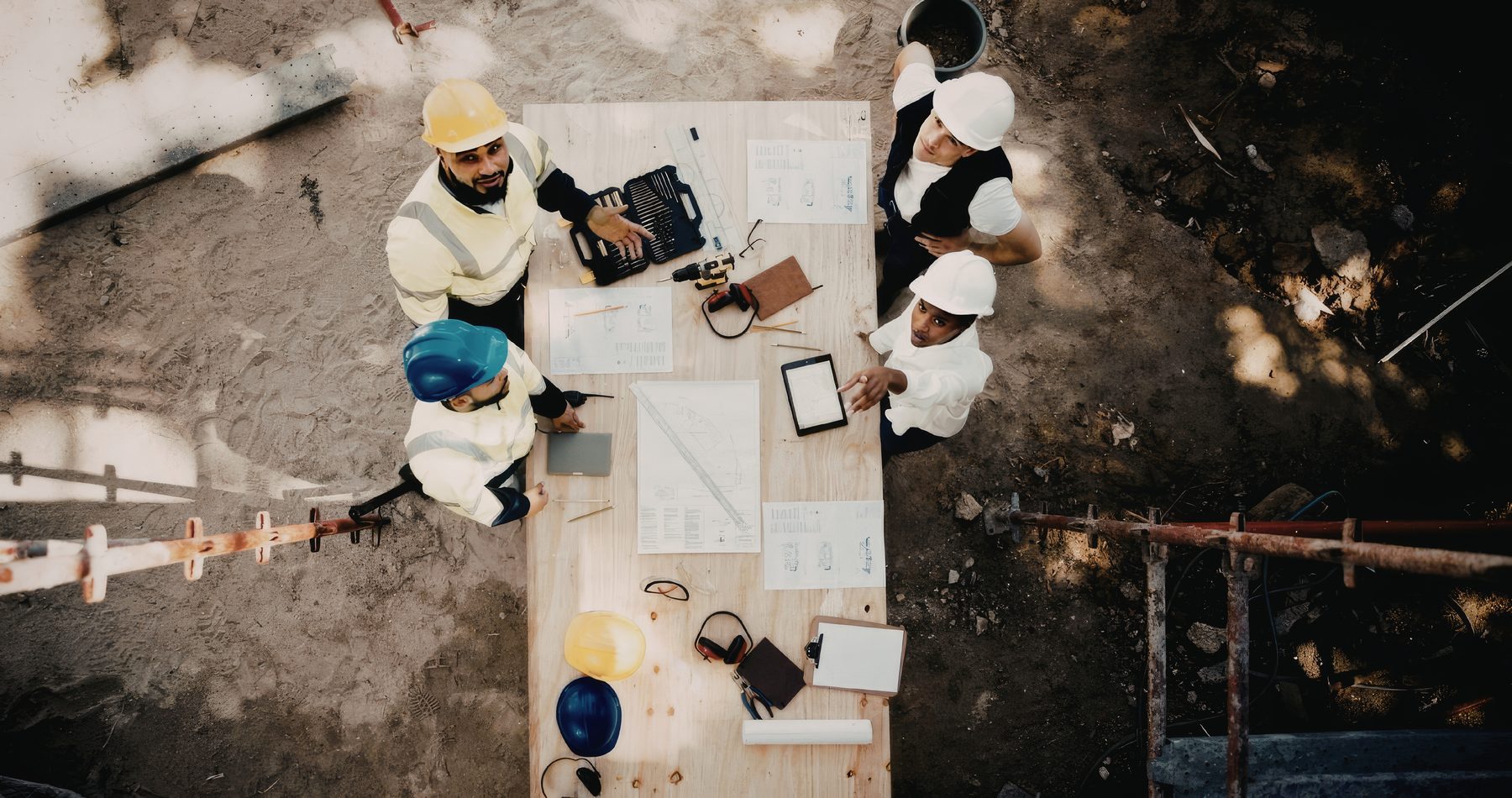 Project team reviewing drawings and equipment on site